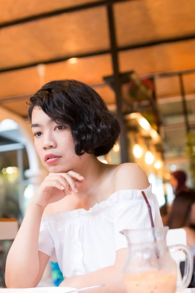 Curly Chin-length Bob With a Side Part