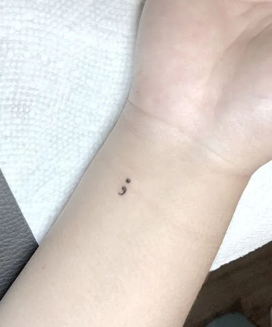  Small meaningful Semicolon tattoo
